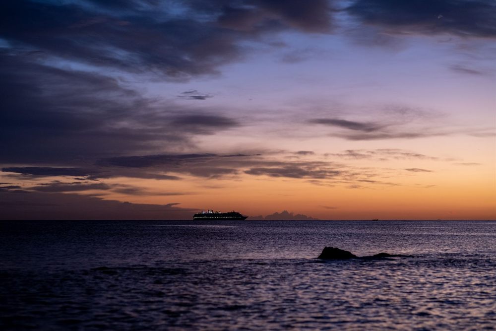Cruise ship on the horizon at dusk off the coast of Puglia, Italy